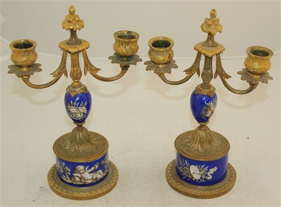 A pair of 19th century French ormolu mounted porcelain candelabra, 10in.